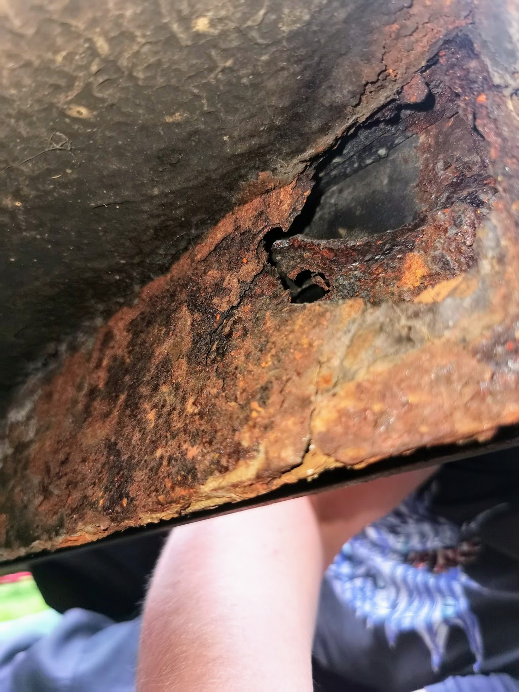 Corrosion damage to the offside rear sill