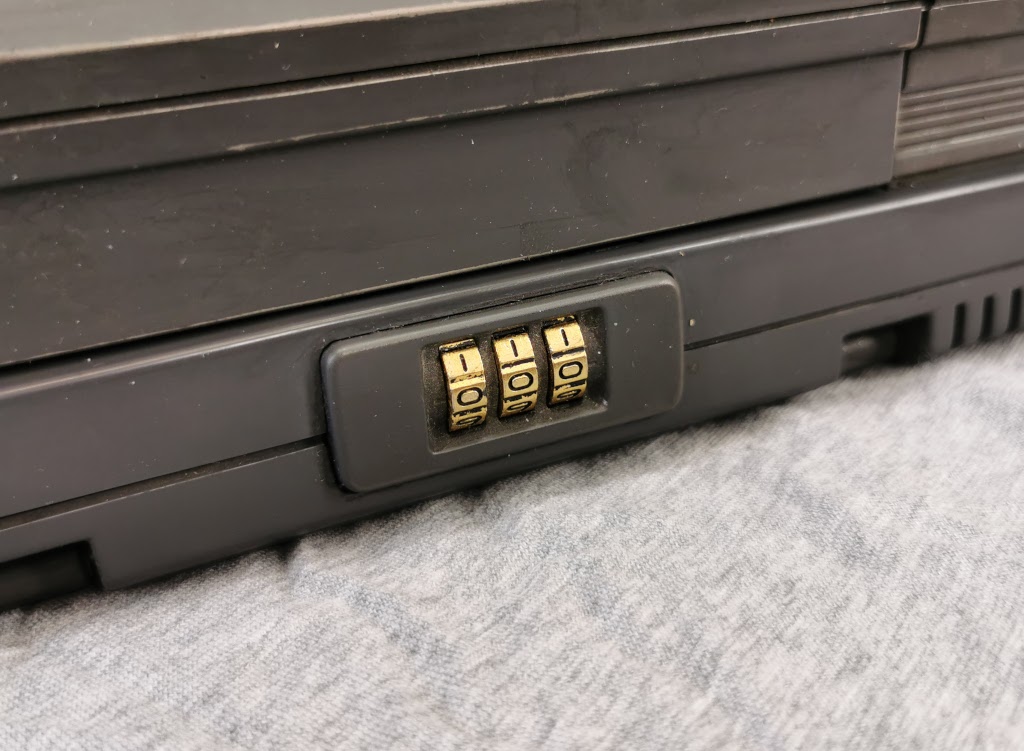 Suitcase style combination lock used to secure the display in the closed position on a Toshiba T5200