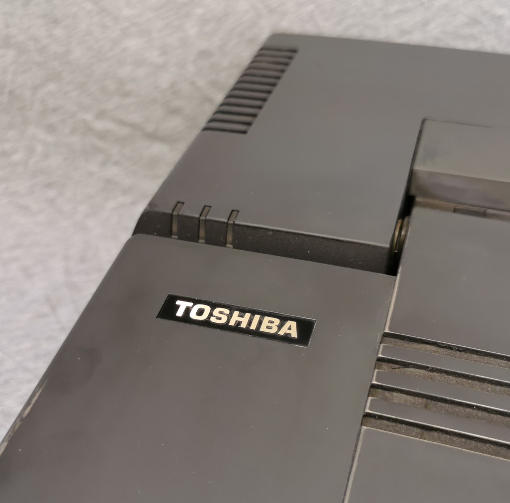 Detail of gold Toshiba badges on T5200