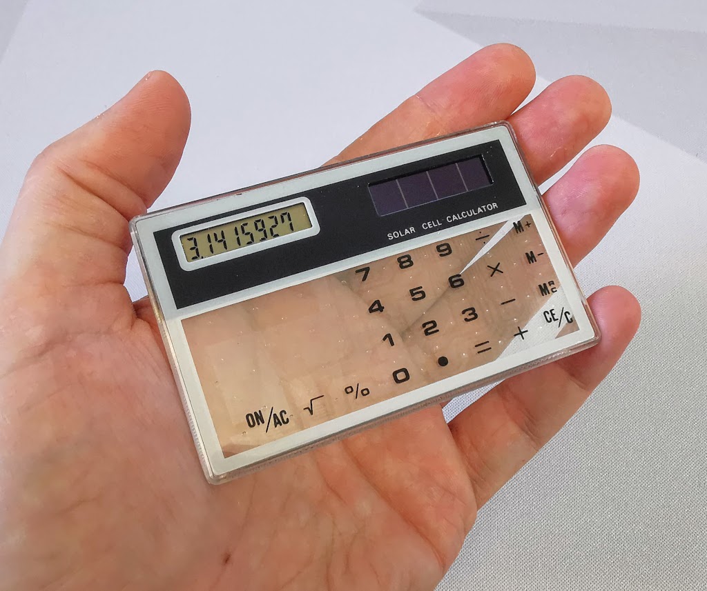 Showing both the size of the generic transparent calculator and showcasing the clear keypad