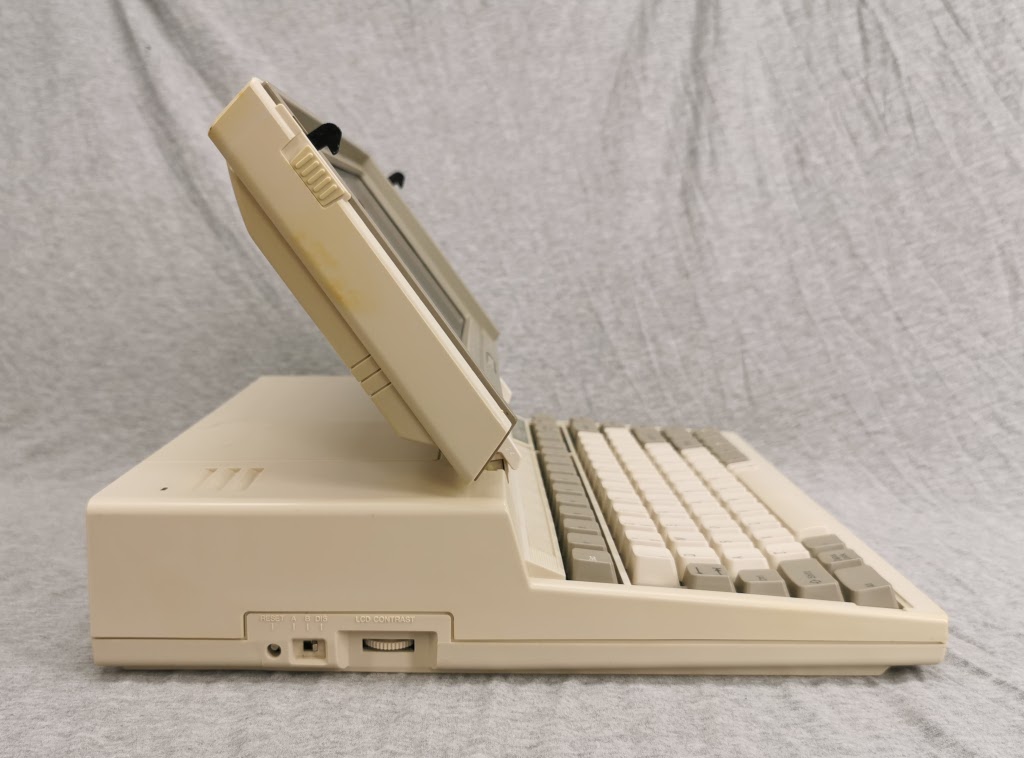 Side profile of a Toshiba T1200 with the screen at a normal viewing angle