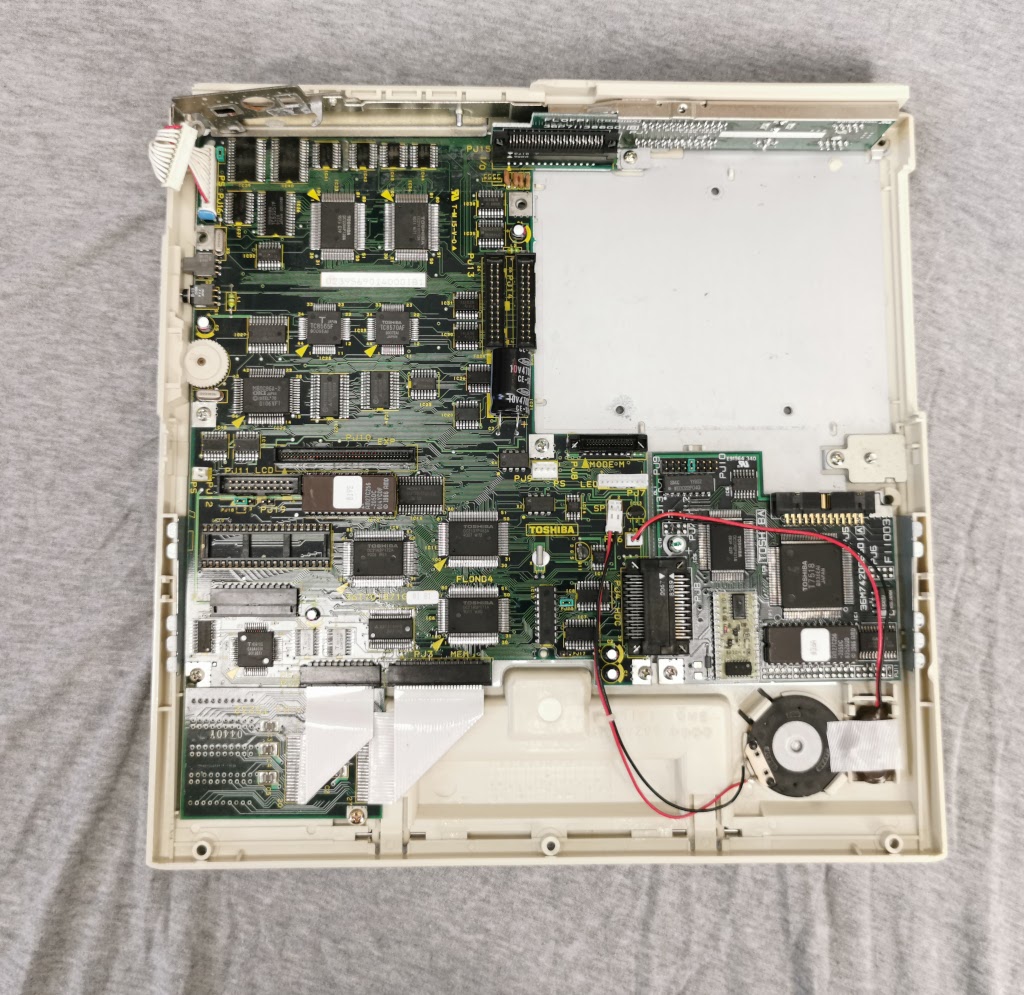 Toshiba T1200 with top cover and all major assemblies removed, viewed from above