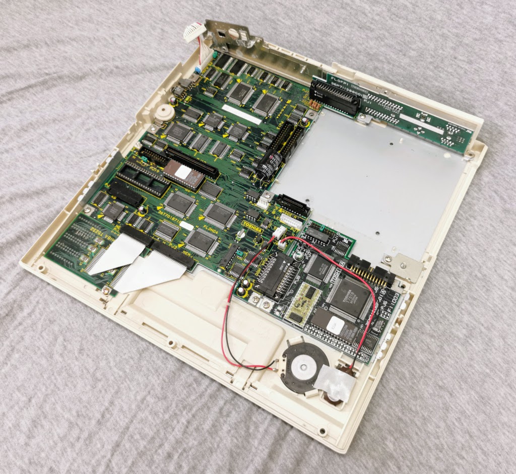 Toshiba T1200 with top cover and all major assemblies removed, viewed from right